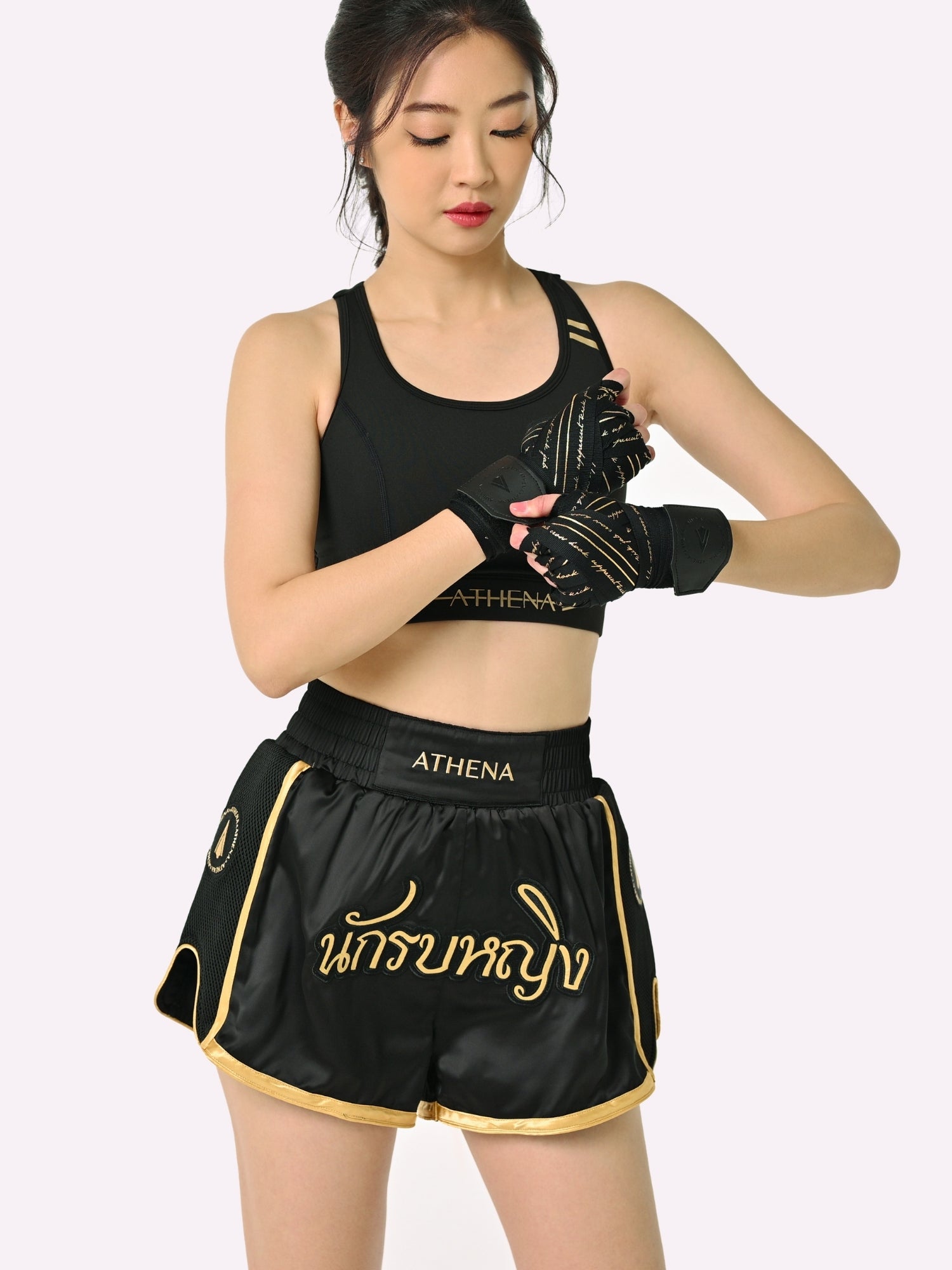 Athena Fightwear Artemisia women's Muay Thai Shorts Black & Gold with in built safety shorts anti camel toe panel pockets and anti ride up design