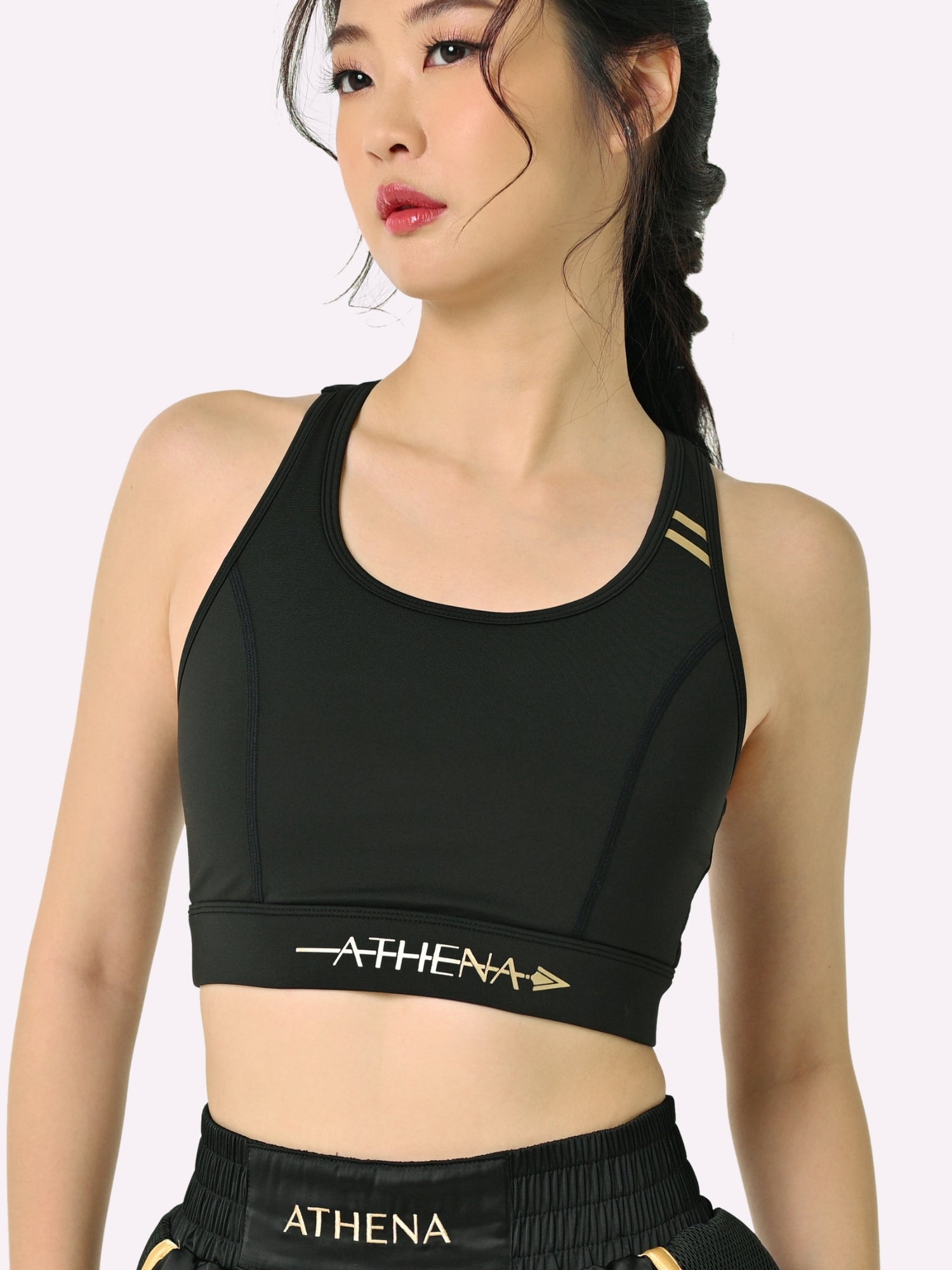Athena Fightwear women's Athena Sports Bra with fully padded chest for support and full nipple and breast coverage no removable bra pads black gold