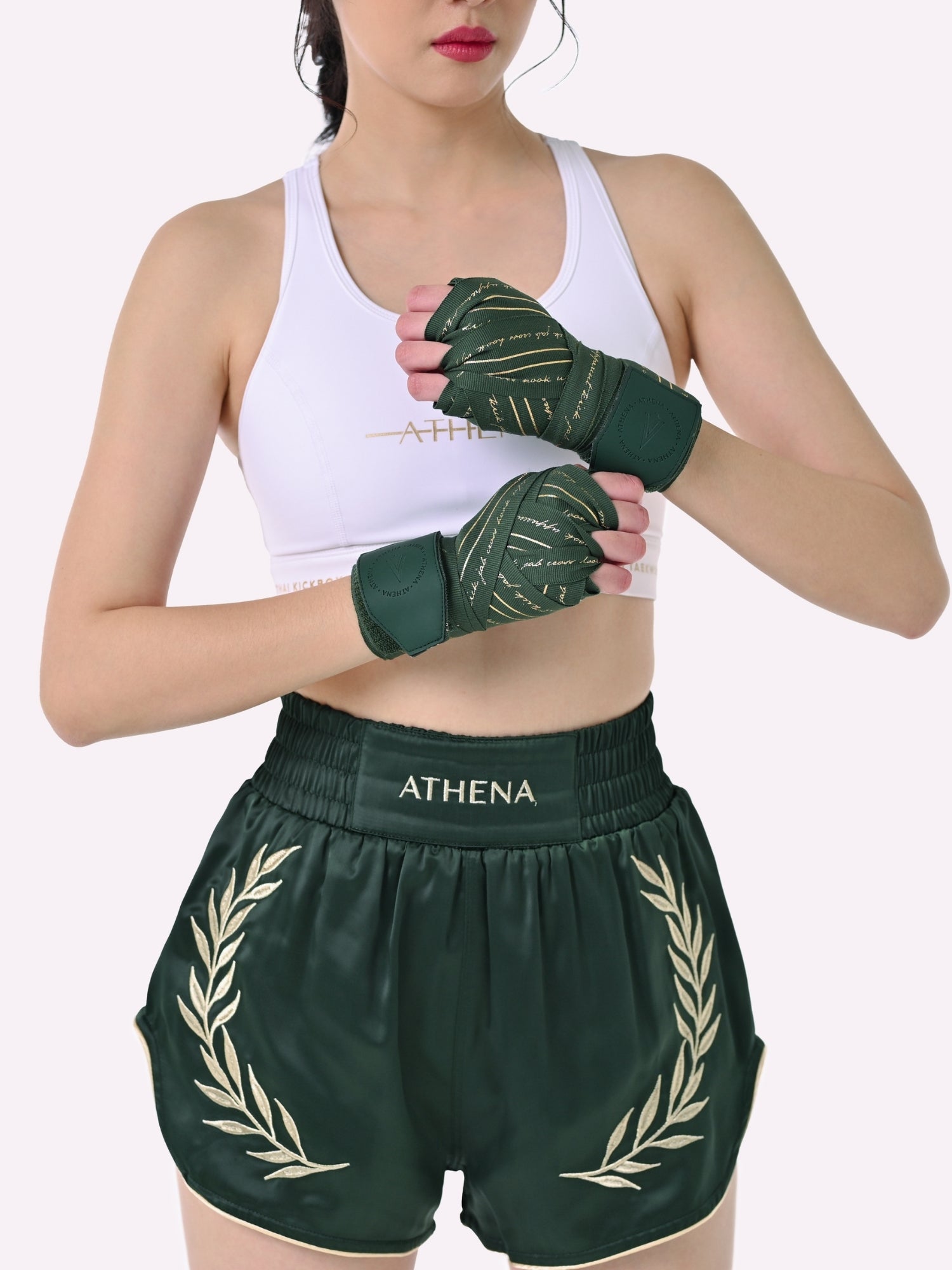 Athena Fightwear Athena Women's Muay Thai Shorts green and gold made with female waist to hip ratio wide hips built-in safety shorts with anti-camel toe and anti-ride up design and pockets