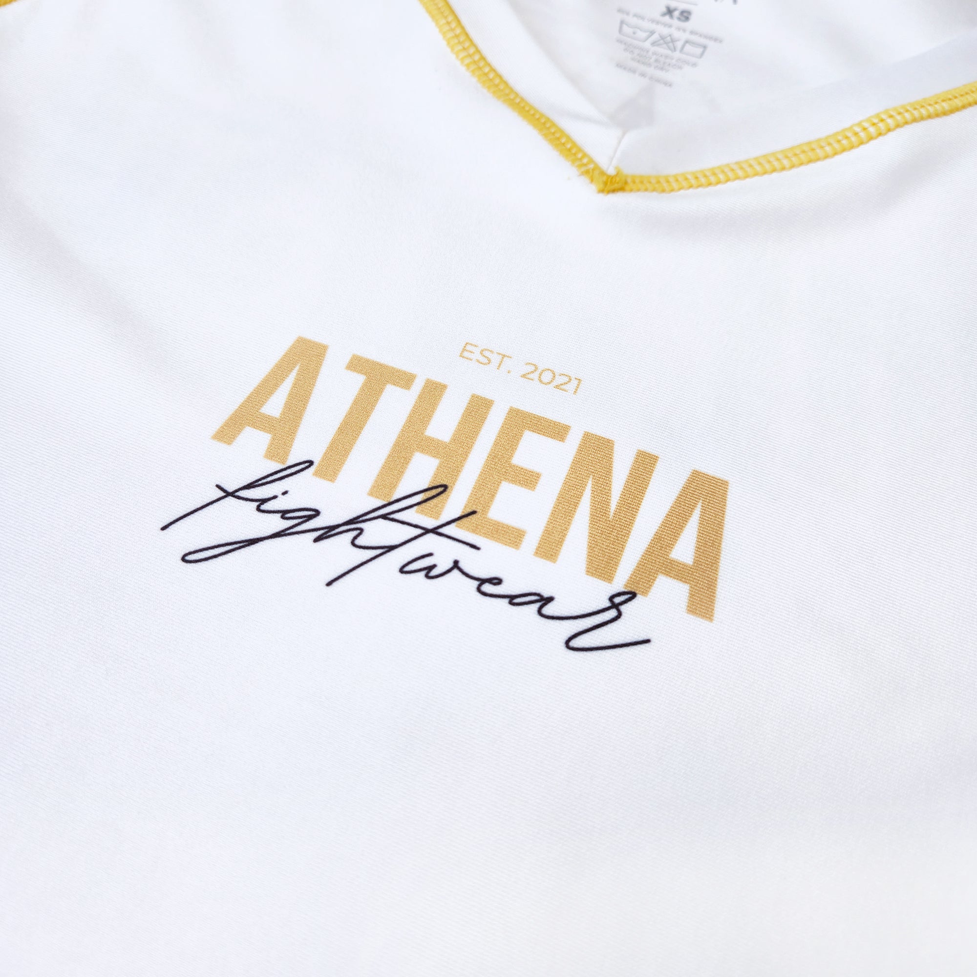 Athena Fightwear women's nogi BJJ MMA grappling short sleeve rashguard with mesh armpits and second skin fit tapered waist