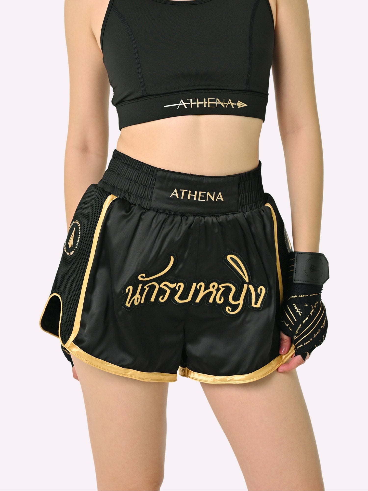 Athena Fightwear Artemisia women's Muay Thai Shorts Black & Gold with in built safety shorts anti camel toe panel pockets and anti ride up design 