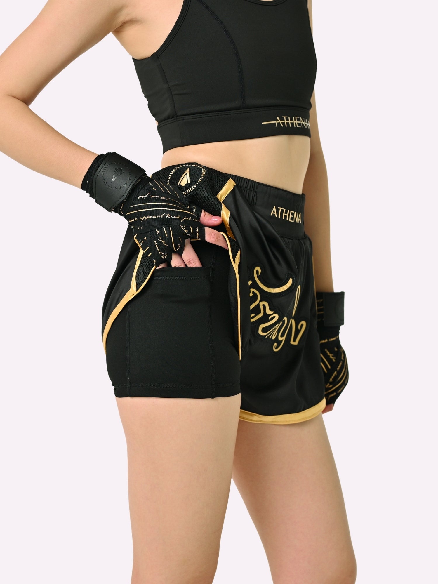 Athena Fightwear Artemisia women's Muay Thai Shorts Black & Gold with in built safety shorts anti camel toe panel pockets and anti ride up design 