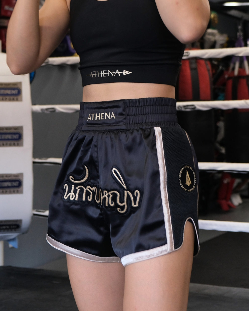 Athena Fightwear women's ladies Muay Thai shorts with wide hips and built in compression shorts warrior women black gold