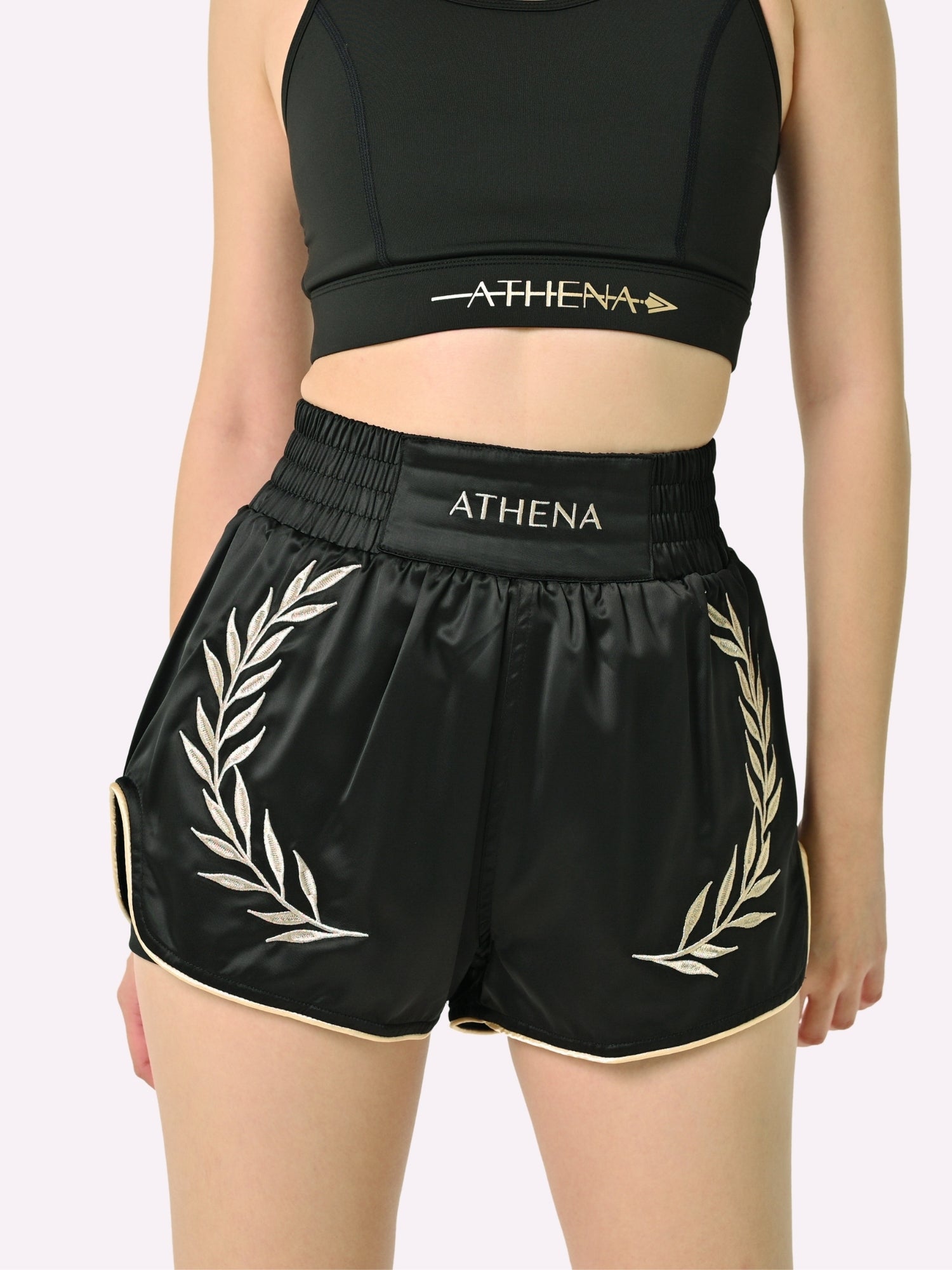 Athena Fightwear Athena Women's Muay Thai Shorts black & gold made with female waist to hip ratio wide hips built-in safety shorts with anti-camel toe and anti-ride up design and pockets