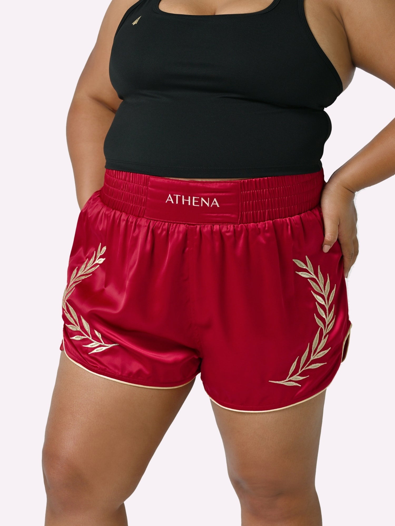 Athena Fightwear Athena Women's Muay Thai Shorts red & gold made with female waist to hip ratio wide hips built-in safety shorts with anti-camel toe and anti-ride up design and pockets