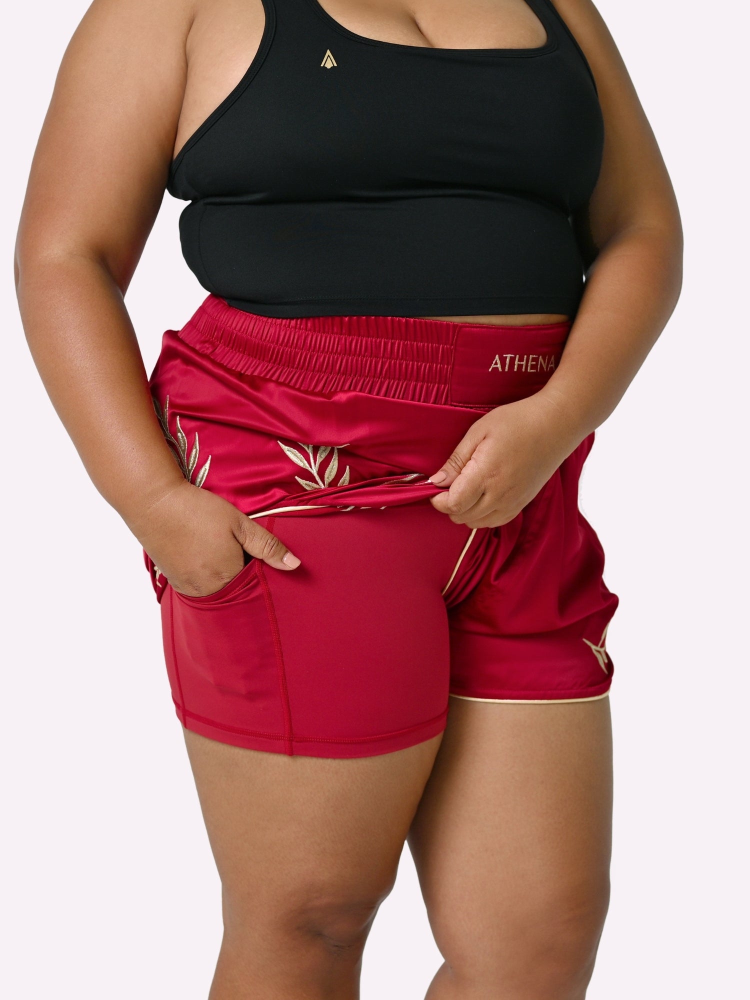 Athena Fightwear Athena Women's Muay Thai Shorts red & gold made with female waist to hip ratio wide hips built-in safety shorts with anti-camel toe and anti-ride up design and pockets