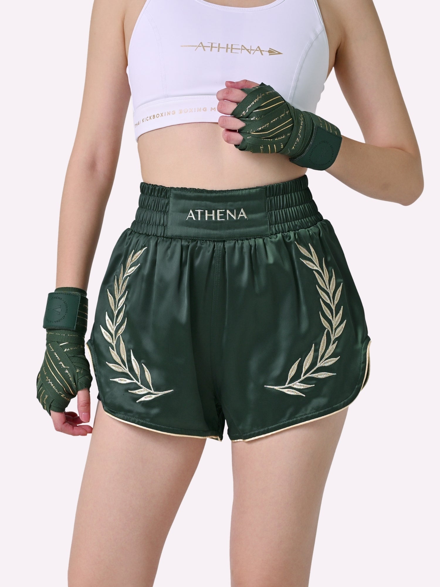Athena Fightwear Athena Women's Muay Thai Shorts green and gold made with female waist to hip ratio wide hips built-in safety shorts with anti-camel toe and anti-ride up design and pockets