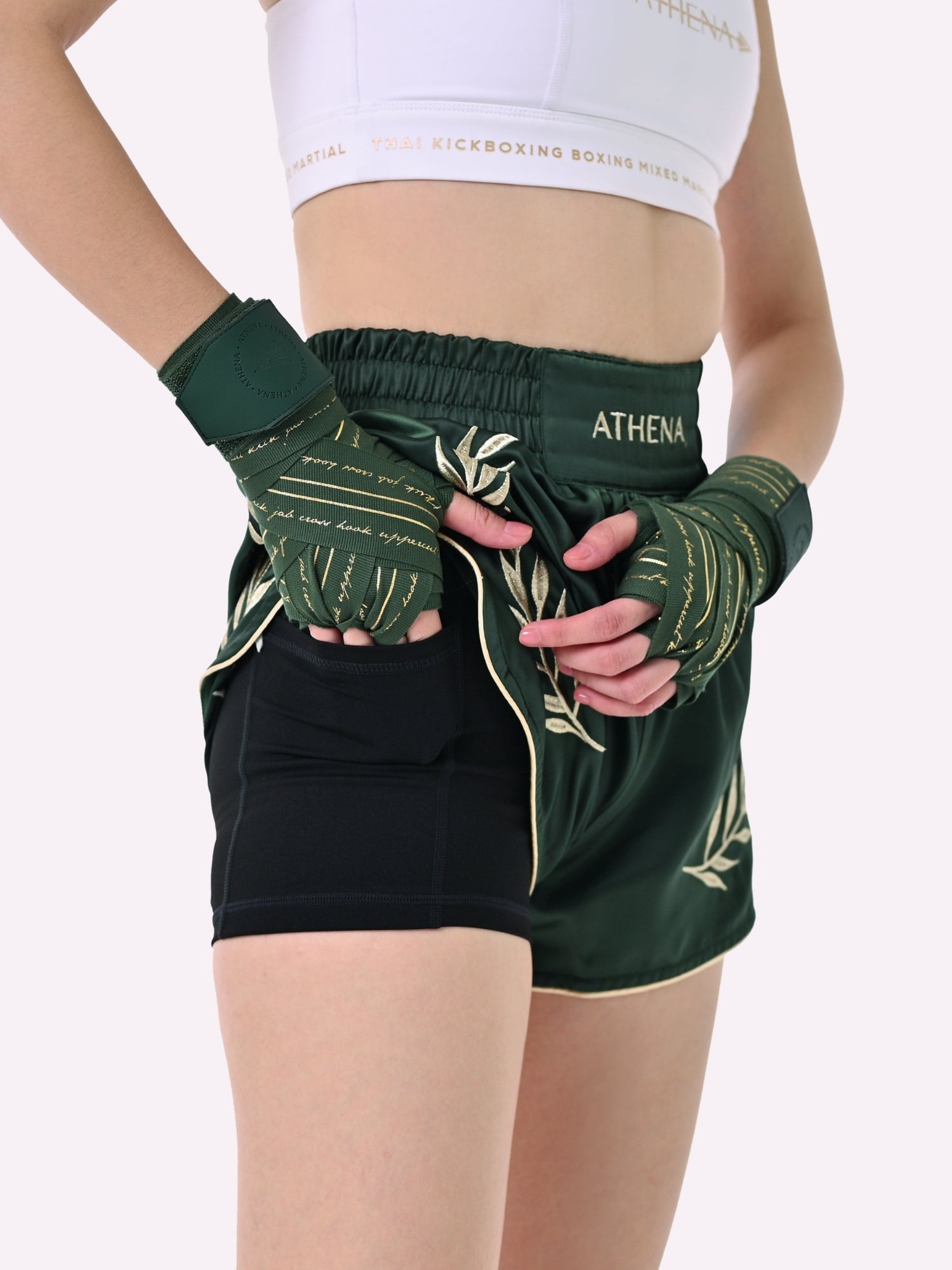 Athena Fightwear Athena Women's Muay Thai Shorts green and gold made with female waist to hip ratio wide hips built-in safety shorts with anti-camel toe and anti-ride up design and pockets