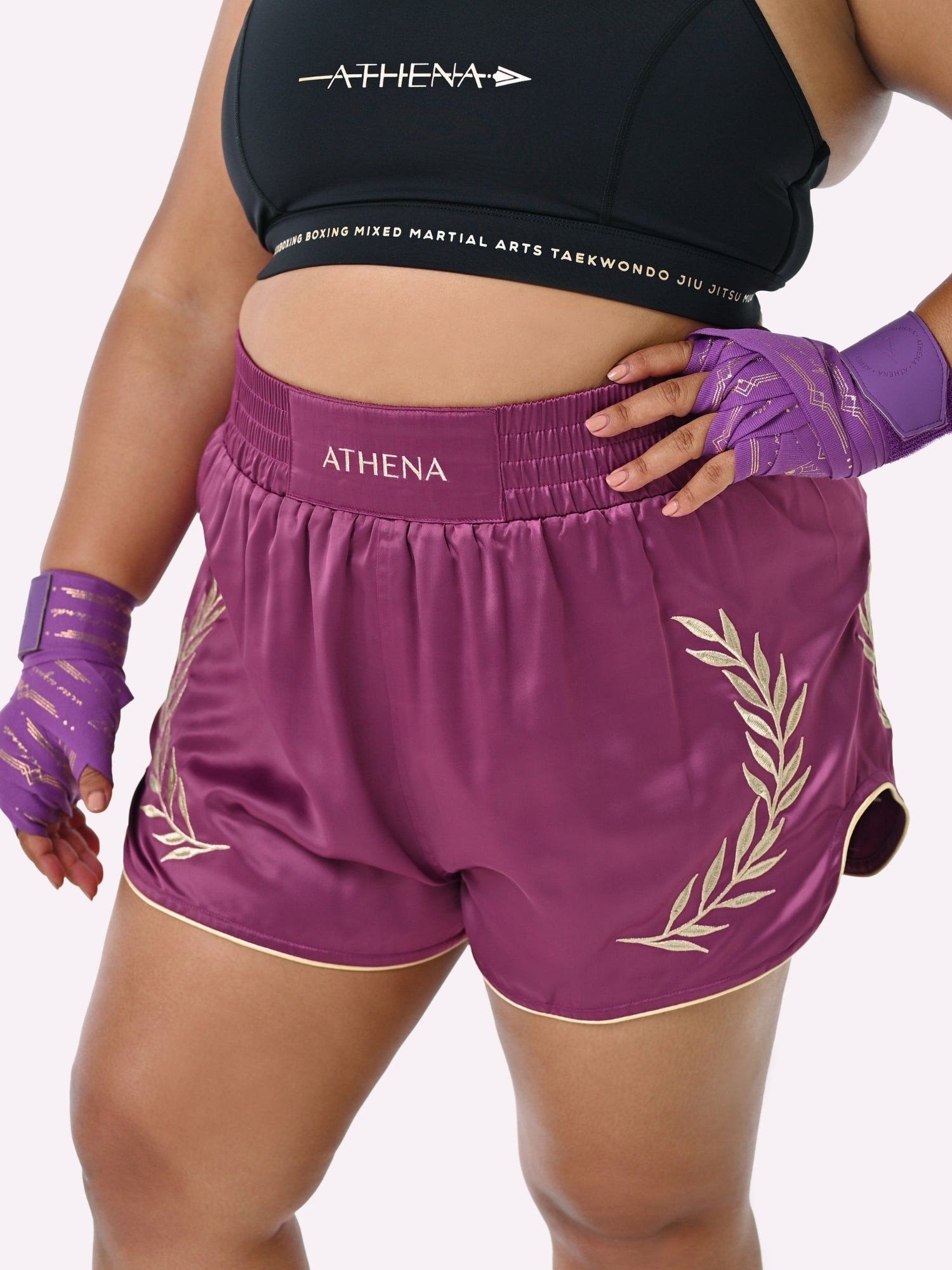 Athena Fightwear Athena Women's Muay Thai Shorts plum purple and gold made with female waist to hip ratio wide hips built-in safety shorts with anti-camel toe and anti-ride up design and pockets