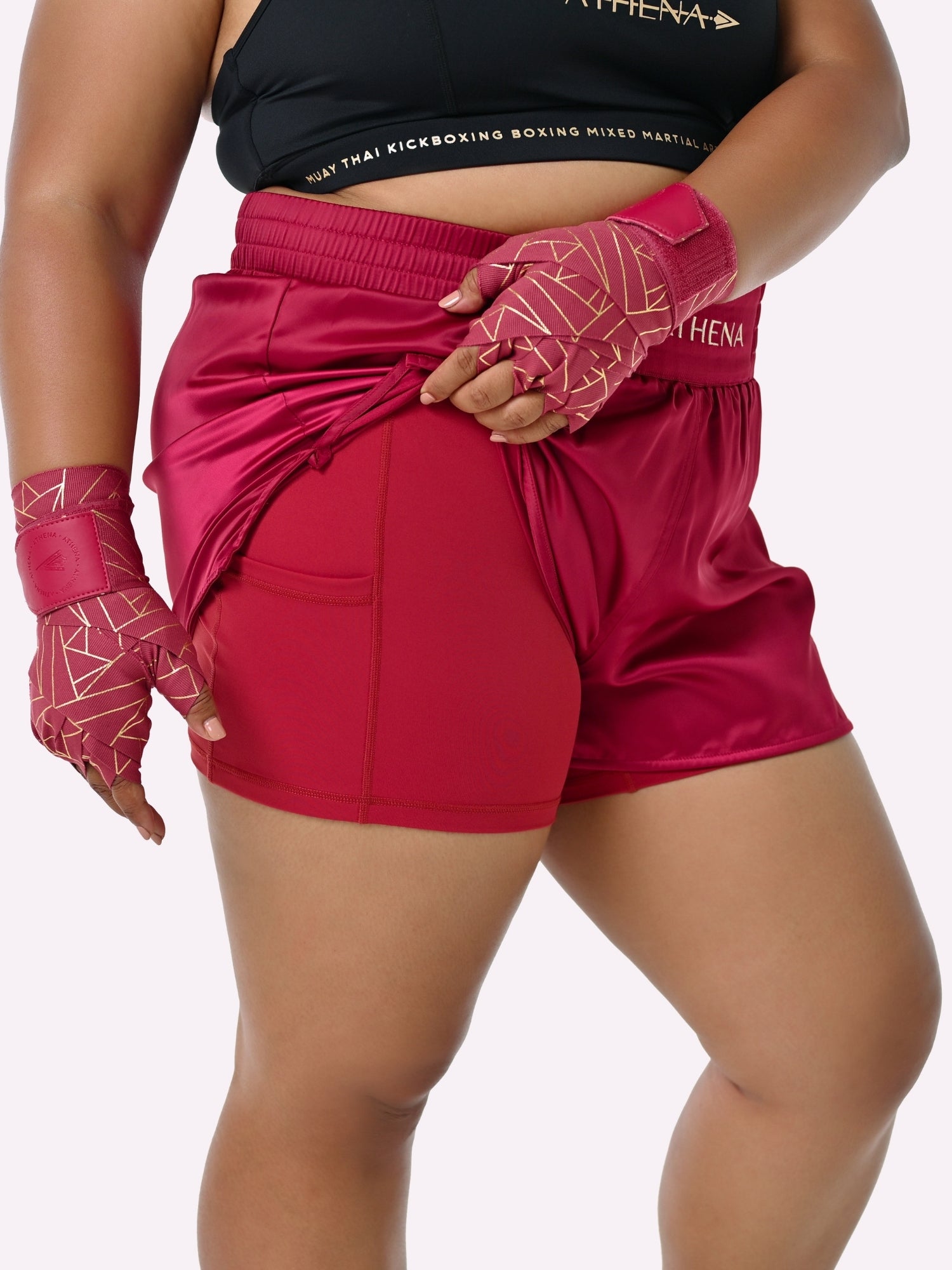 Athena Fightwear Enyo Women's Muay Thai Shorts Berry Red made for the female body with built-in anti-camel toe and anti-ride up safety shorts with pockets