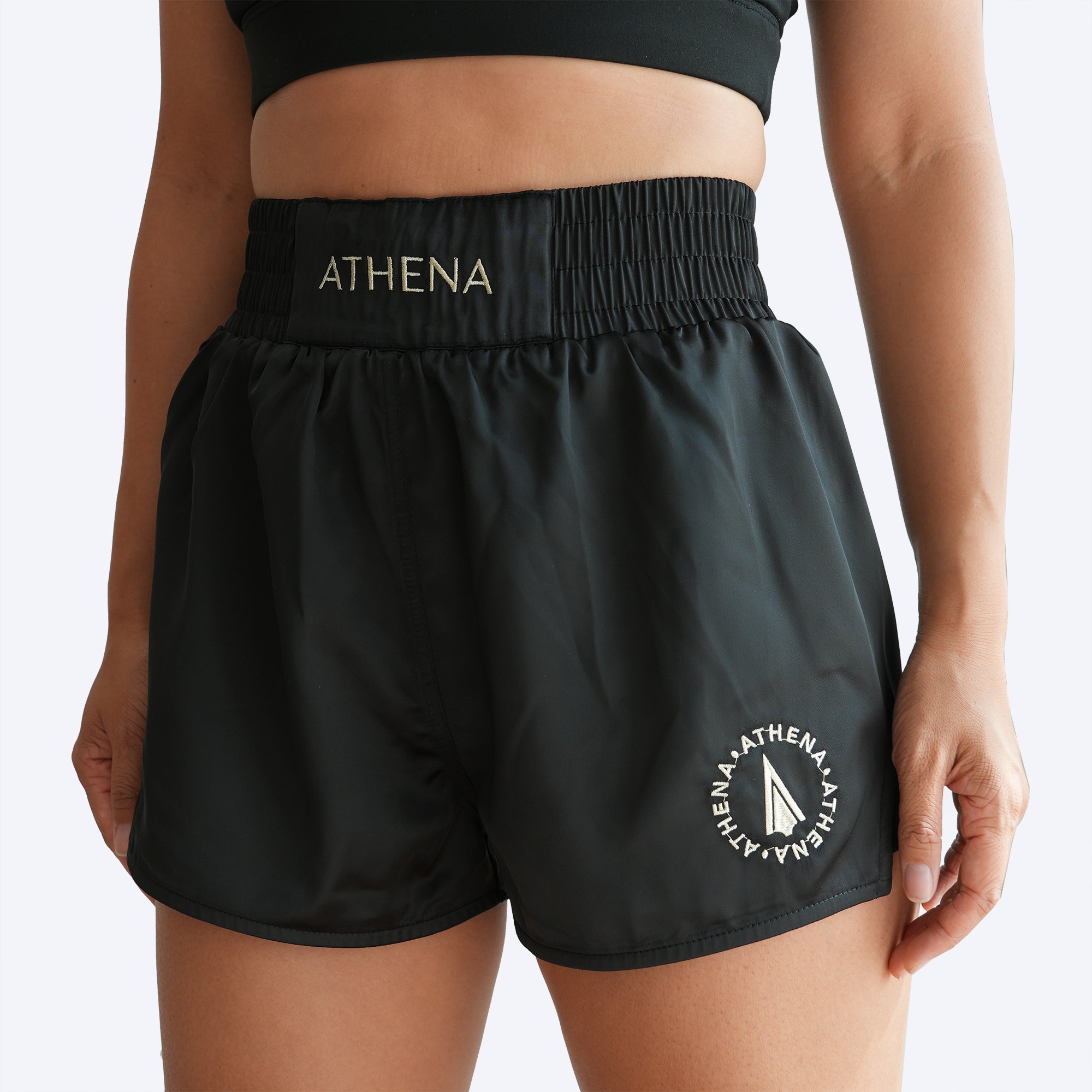 Athena Fightwear Enyo women's muay thai shorts black gold with wide hips and built in safety shorts with anti camel toe anti ride up and pockets